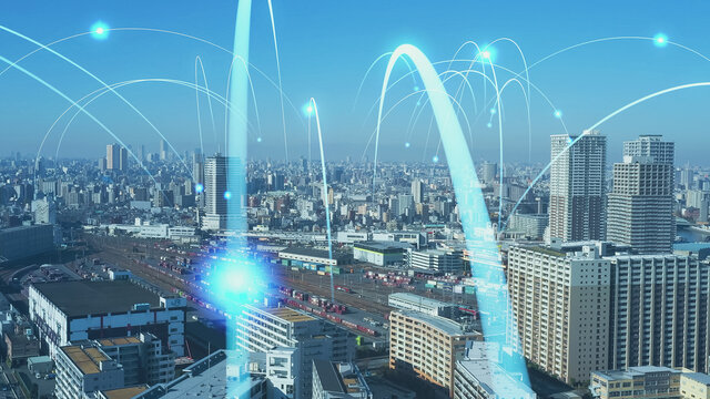現代都市の空撮とネットワークイメージ