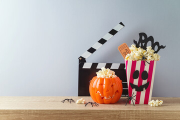 Horror movie night and Halloween party concept with jack o lantern pumpkin,  popcorn and movie...