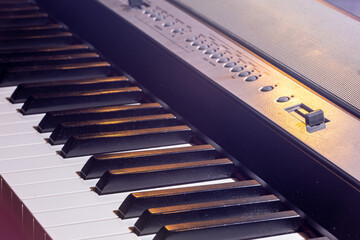 Close-up of a synthesizer or piano keys with highlights.