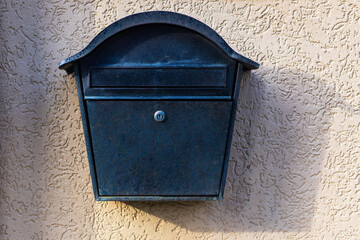 Elegant mailbox hangs on a relief wall