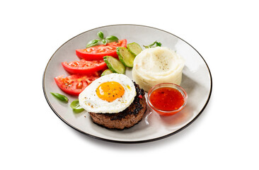 Juicy Chopped  steak with fried egg, mashed potatoes and tomato slices. isolated on white background
