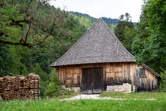 Old wooden barn in the middle of the forest in the mountains of France