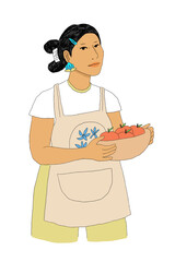 Young woman wearing apron holding basket of apples