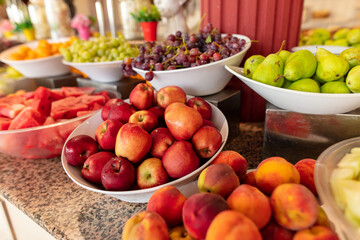 Apples, peaches and other fruits on the table.