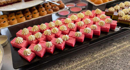 Sweet cake on a shelf in a cafe.