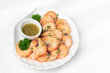 Fototapeta na wymiar fresh boiled prawns with zesty citrus dipping sauce