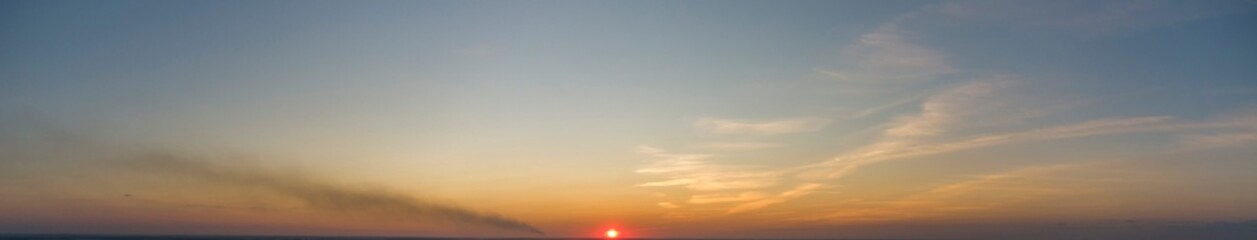 Fototapeta na wymiar Panorama of sunrise. Pink sky.