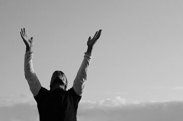 Fototapeta na wymiar man praying with sky background stock photo