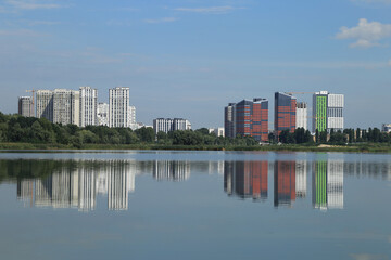 Fototapeta na wymiar urban buildings on the shore of a large lake