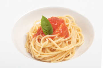 Spaghetti with tomato sauce, photo on the white background