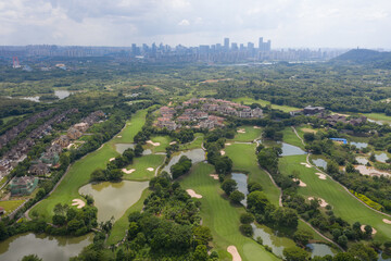 Aerial photography of golf course and city view