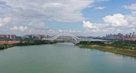 Fototapeta na wymiar Railway arch bridge across the river in Nanning, China