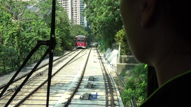 Onboard cockpit view of funicular tram is a form of cable railway which connects points along tracks laid on a steep slope where two counterbalanced cars are permanently attached to opposite ends