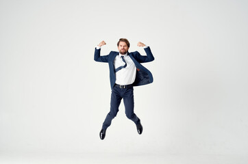 business man in a suit emotions jumping full height Victory