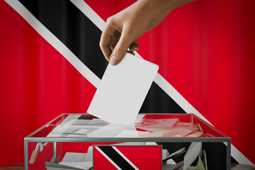 Trinidad and Tobago flag, hand dropping ballot card into a box - voting, election concept - 3D illustration