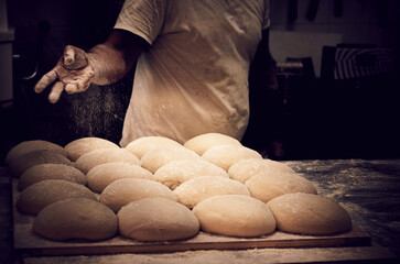 Traditional bread baker kenading dough