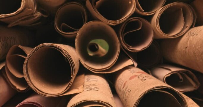 Ancient scroll library. Vintage scrolls stacked on a pile.