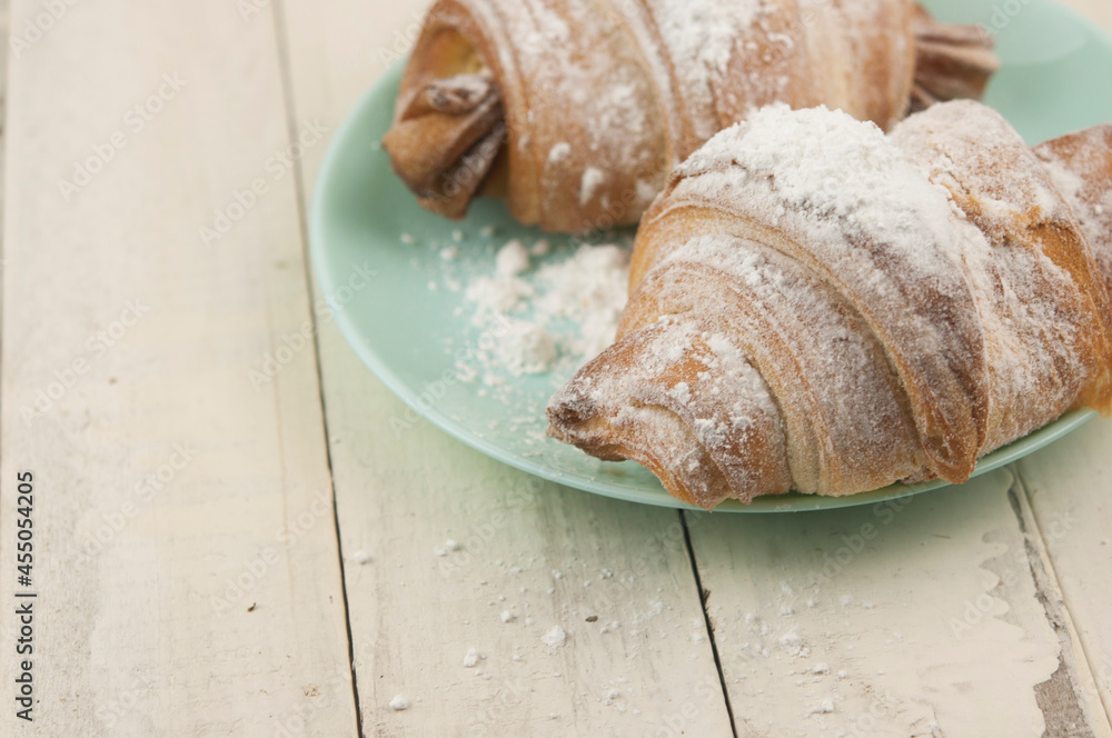 Wall mural Croissant on plate in the restaurant