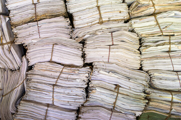 stack of old invoice documents in the archive