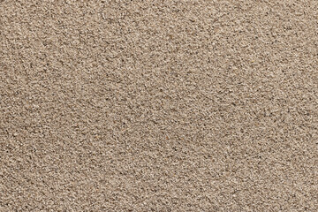 Large sea sand as a background and wallpaper, closeup.