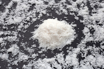 White salt on dark background.