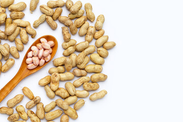 Raw peanuts on white background.
