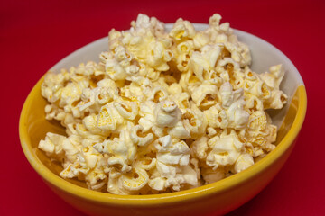 Popcorn is a snack that is a small portion of food generally eaten between meals popular in Thailand.