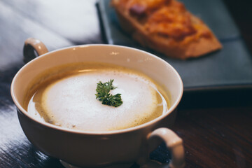 A bowl of delicious homemade cream of mushroom soup  background