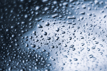rain water drops in tone of blue feeling blue through window nature influenced background