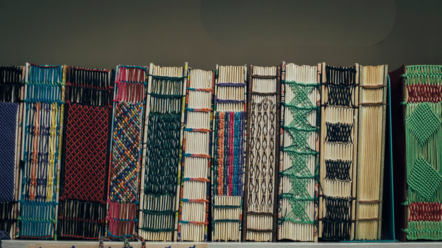 vintage craft Handmade leather book cover . Handmade, custom sewing notebook detail with white, light blue and dark blue pages. book on shelf. writting readding idea