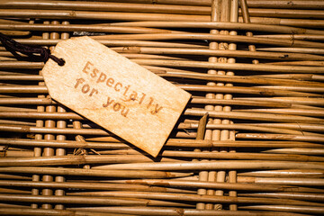 Close Up Of A wooden Label With  Ribbon On Wooden Background With English Text Thank You Frame And Vintage Or Retro Style