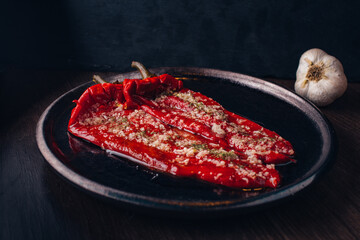 Grilled paprika with onion dark background