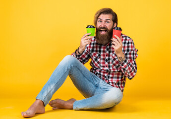 good morning. energetic warm take away beverage. need some coffee to go for inspiration. happy bearded man drinking morning coffee. man drink hot tea from paper cup. copy space