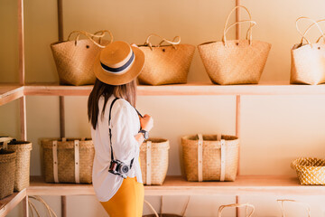 Traveler or blogger woman in souvenir shop, Fashion stylish tourist girl looking Krajood hand bags...