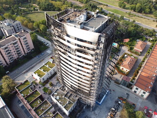 Milan, Italy - September 5, 2021: street view of the burned skyscraper Torre dei Moro in Milan,...
