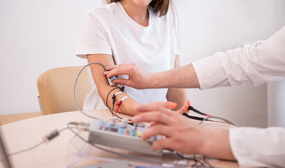 Patient nerves testing using electromyography at medical center
