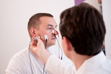 Patient nerves testing using electromyography at medical center