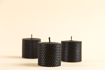 Colored, unusual handmade candles, of natural wax with texture of honeycomb bees, an element of the interior.