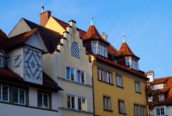 Fototapeta na wymiar Beautiful and quaint German houses on Island of Lindau against the blue sky
