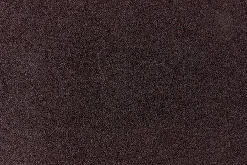 Sandpaper texture. Sandpaper close-up. Abrasive texture. Grainy texture.