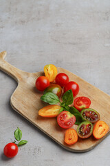 Cherry tomatoes - assorted multicolored tomato, parsley on table, space for text