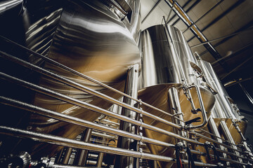 Rows of steel tanks for beer fermentation and maturation in a craft brewery