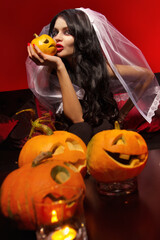 Woman with halloween pumpkin