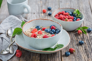 Granola with blueberries and raspberries. Oat flakes with berries.