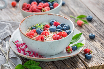 Healthy granola with milk and berries. Flakes with berries.