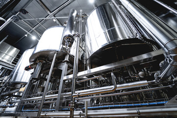 Rows of steel tanks for beer fermentation and maturation in a craft brewery