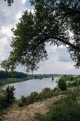 Picturesque view of the river. Bridge over the river. Beautiful river bank. Western Dvina. Polotsk, Belarus