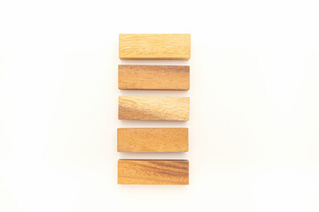 Top view of five empty wooden blocks isolated on white background