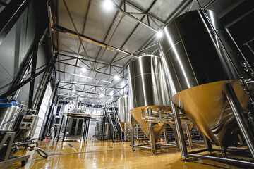 Rows of steel tanks for beer fermentation and maturation in a craft brewery