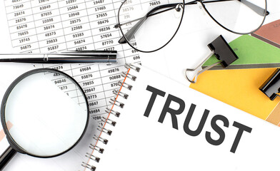 TRUST - the inscription of text on the Notepad, and chart. Business concept